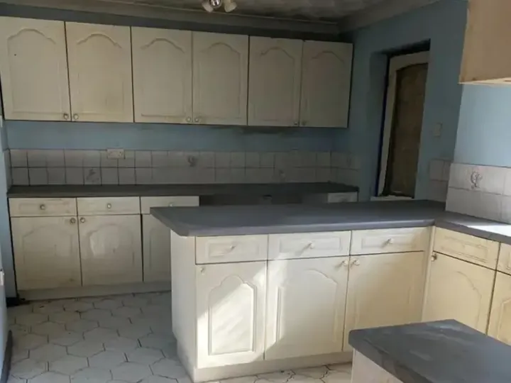After kitchen clearance showing a clean, cleared and usable kitchen space following waste removal